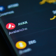 Avalanche AVAX on the mobile phone. Crypto chart is seen in the mobile App.